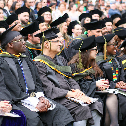 Group of students in cap and gowns at graduation