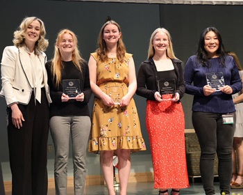 Group photo of students holding their awards