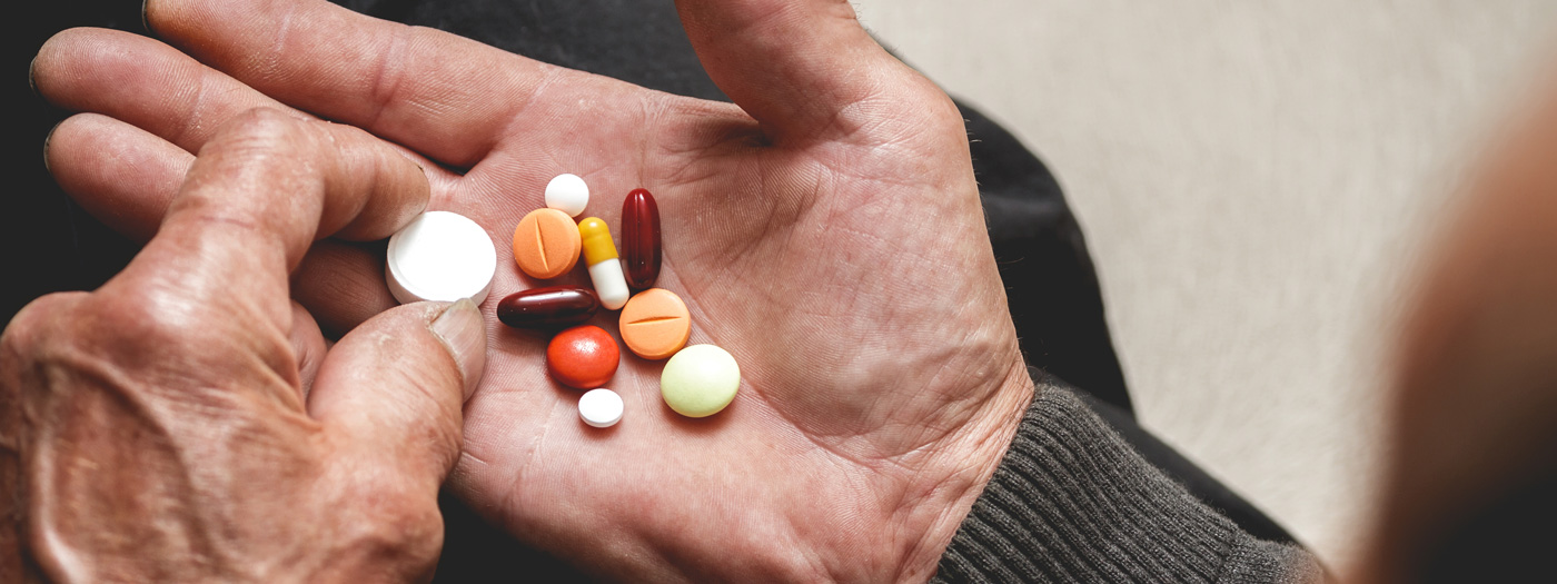 Person holding pills