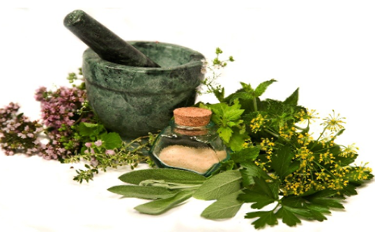 Mortar and pestle with herbs.