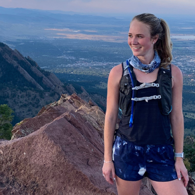 Madeline on top of mountain