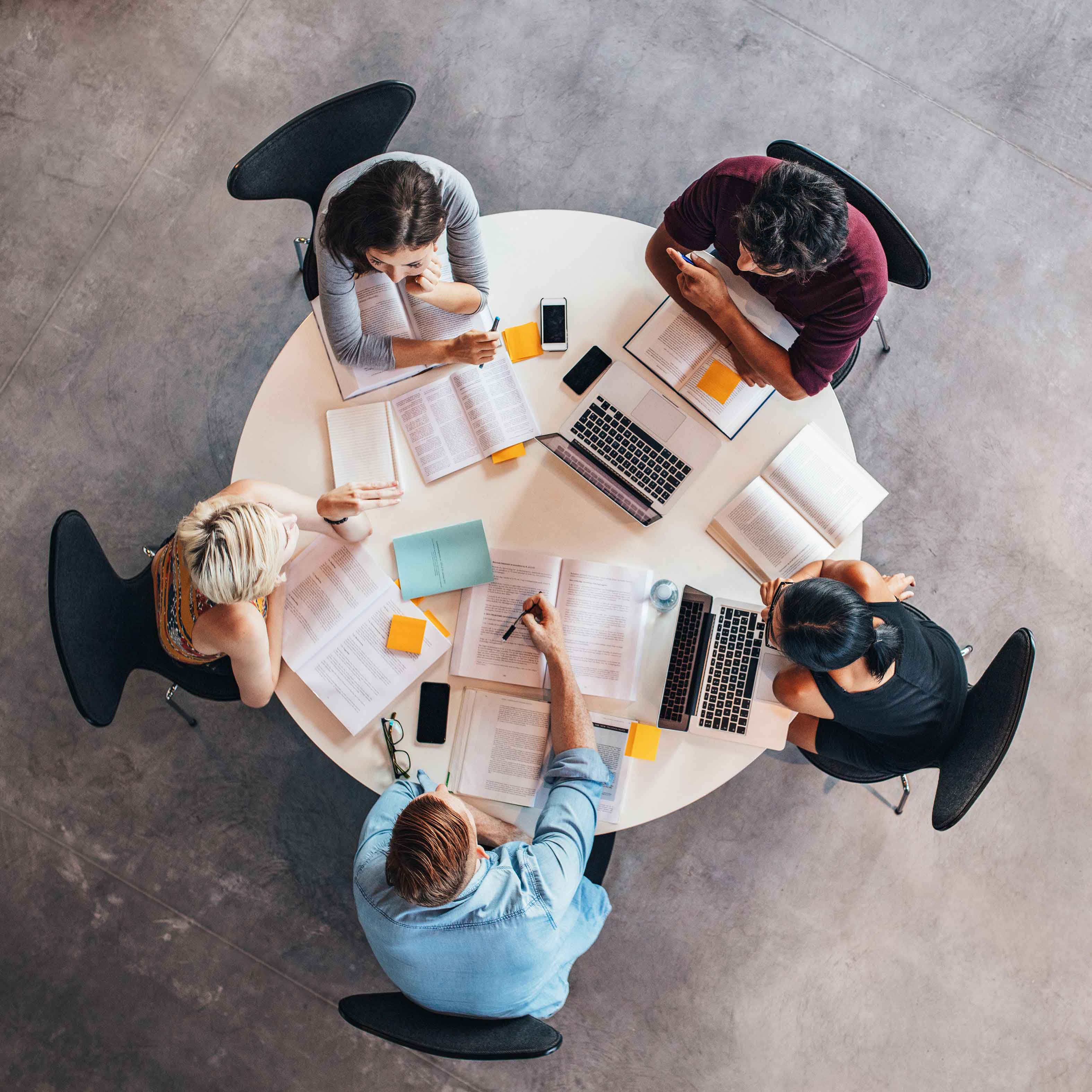 Researchers in a circle table discussing