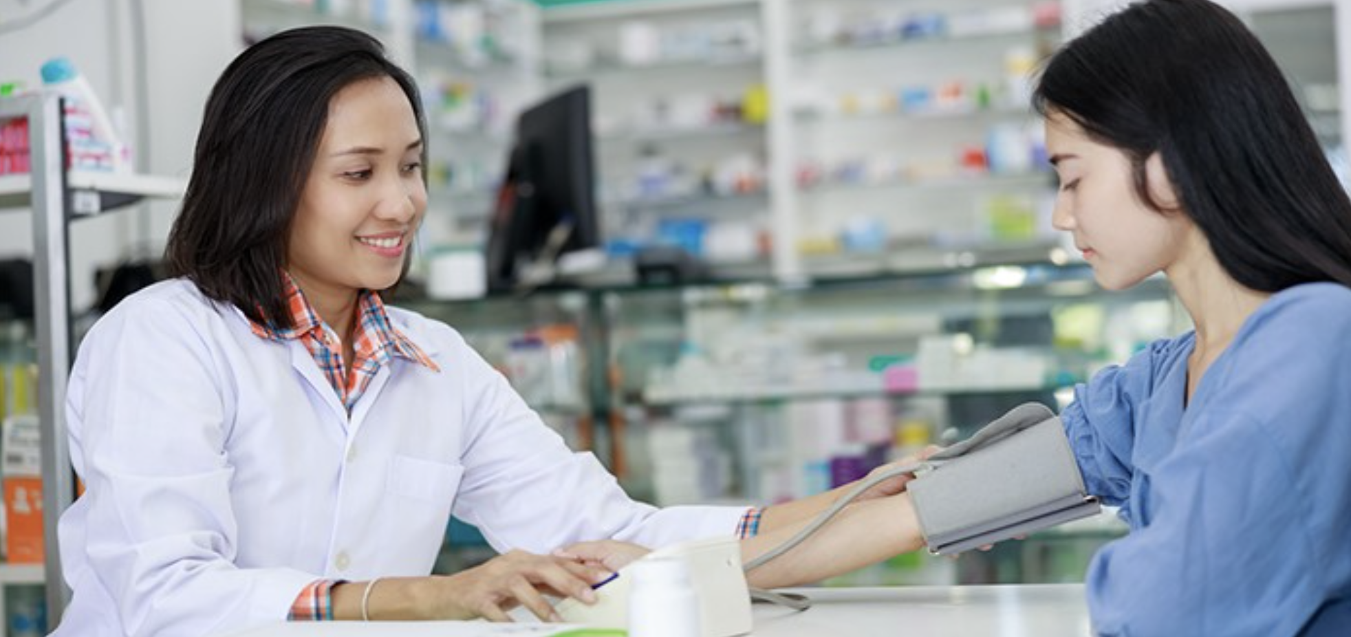 Woman getting blood pressure checked