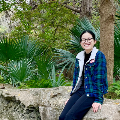 uyen sitting on a rock